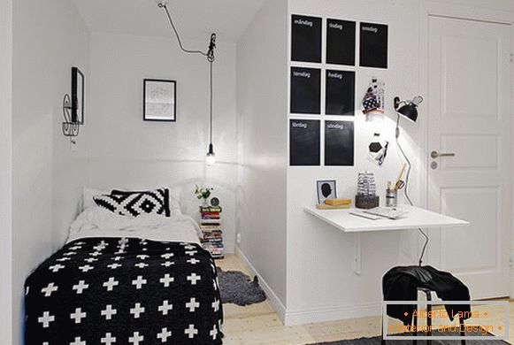 Stylish small bedroom in black and white colors