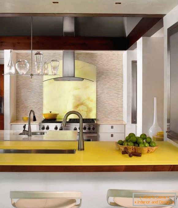Pale yellow color in the interior of the kitchen of a private house