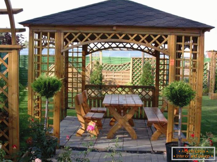 Refined arbor for a yard in Scandinavian style.