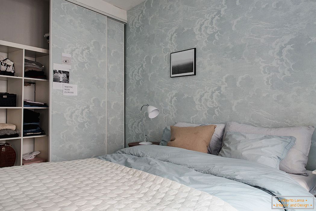 Interior of the bedroom in white and blue tones