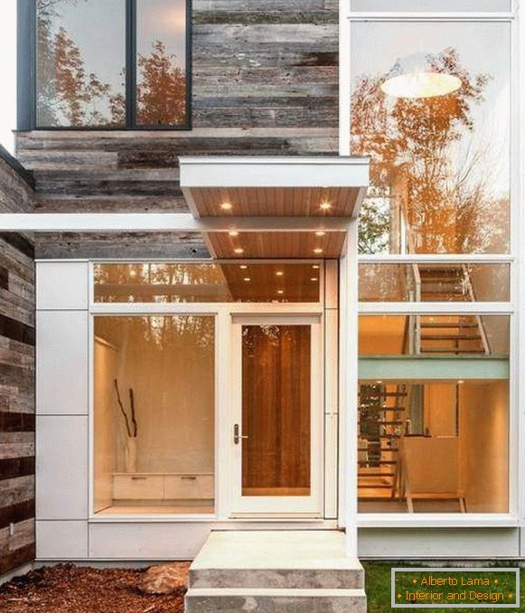 A small modern porch made of concrete with a beautiful visor