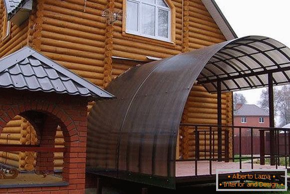 A large porch made of polycarbonate - a photo of a private house