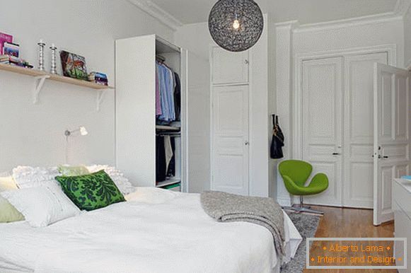 Green accents in the white bedroom