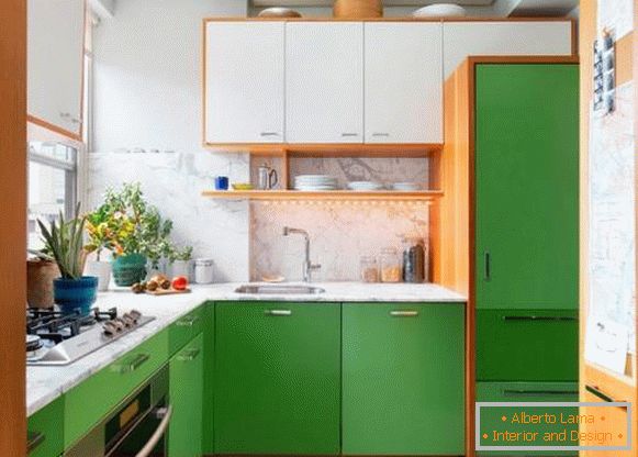 A small kitchen in white and green tones