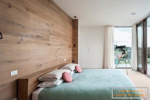 Decorating the walls with a tree - a photo of a modern bedroom