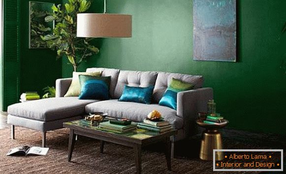 Dark green wallpaper for walls and a light sofa