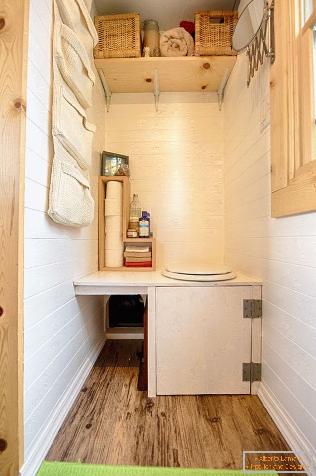 A bathroom of a small wooden cottage