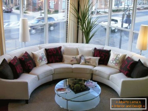 Semicircular corner sofa in the interior photo