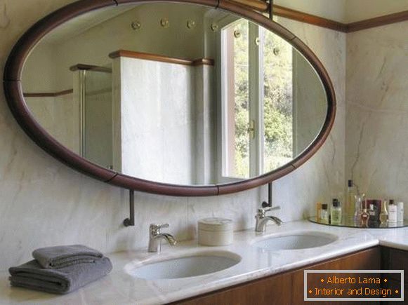 Large oval mirror in the bathroom