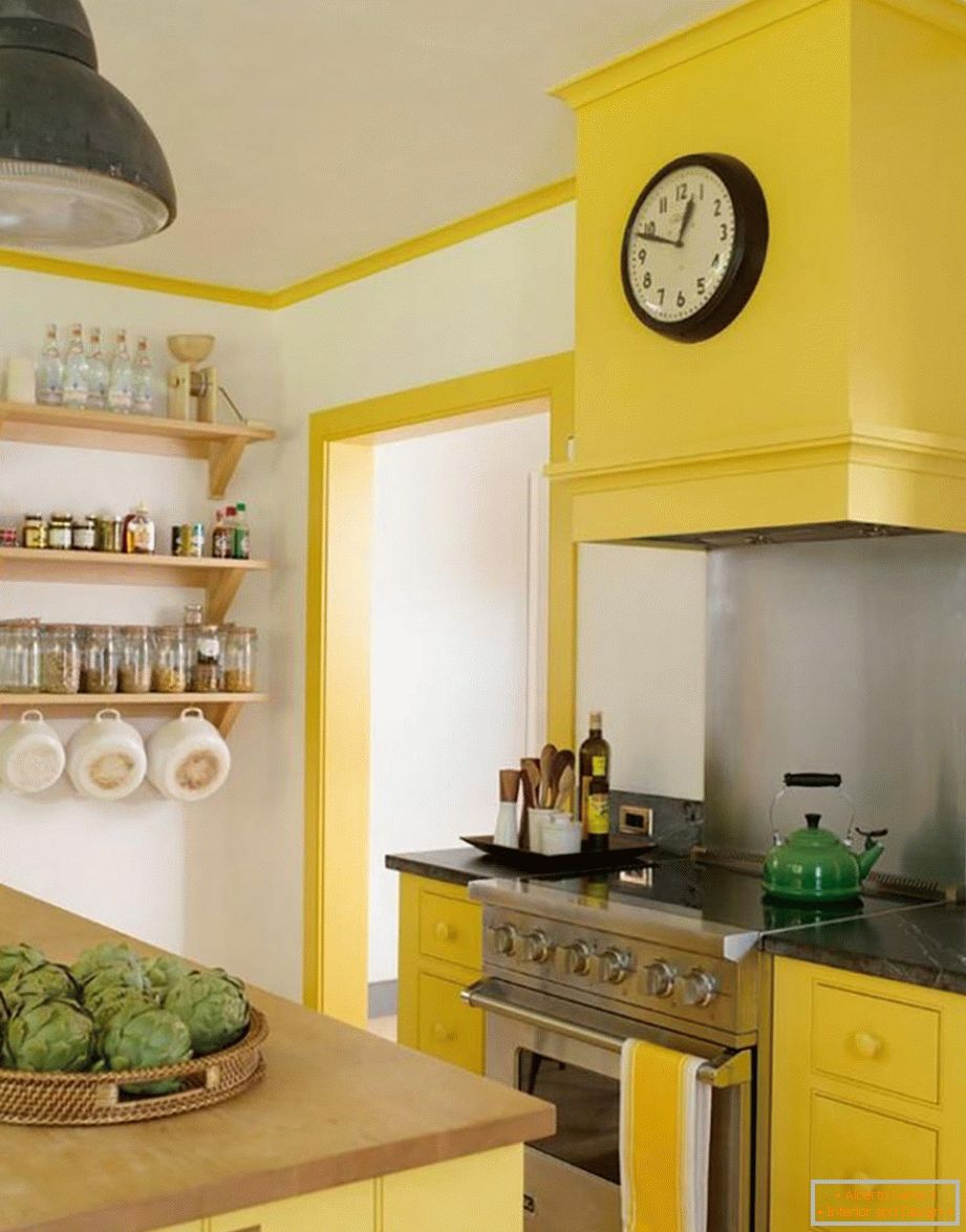 The combination of white, gray and yellow colors in the kitchen
