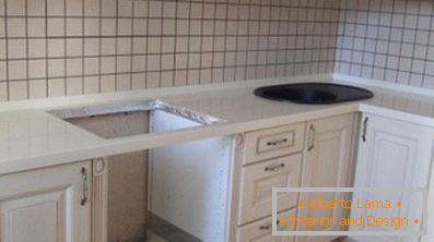What are the countertops made of artificial stone