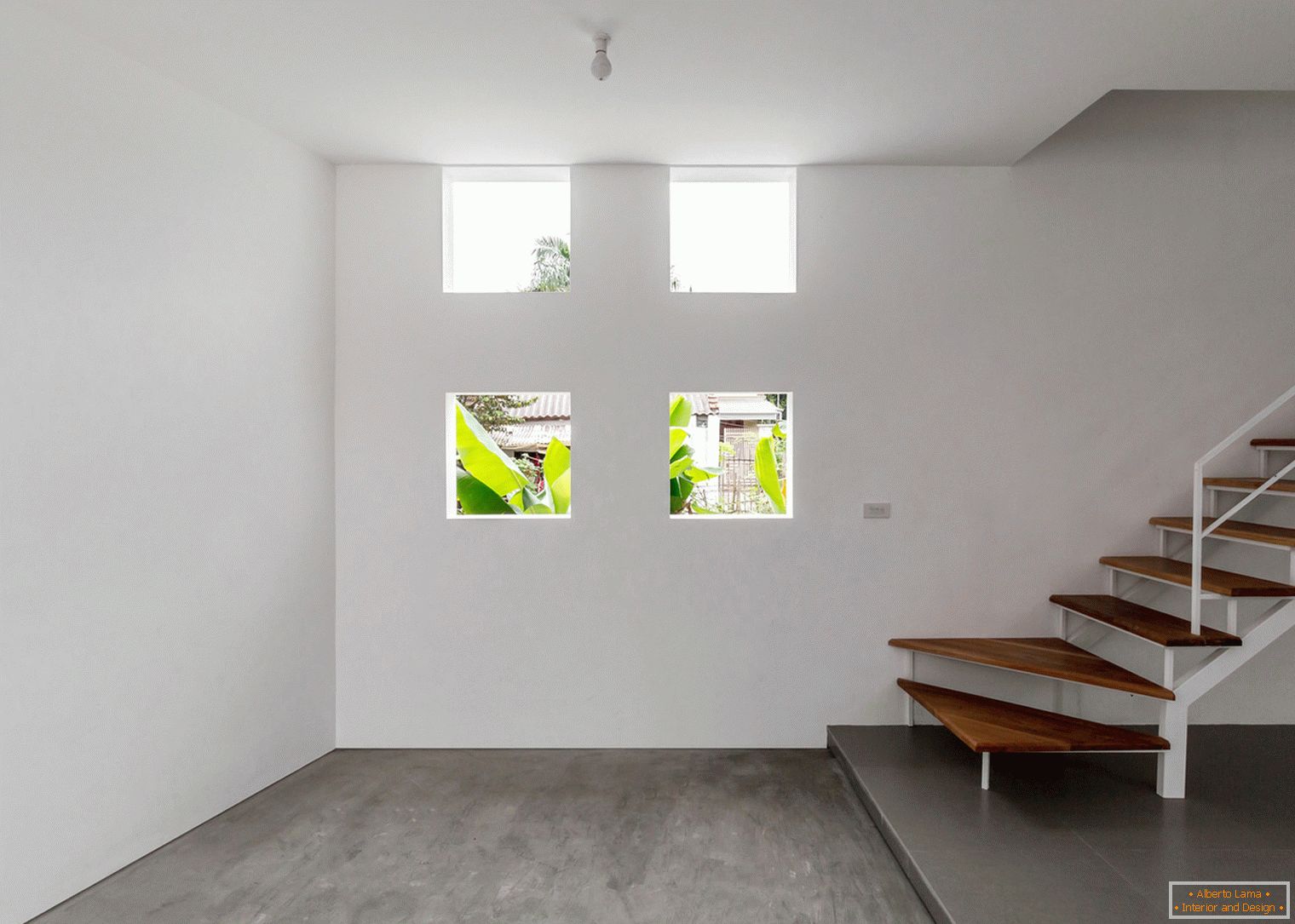 A narrow concrete house full of light and air, in one of the